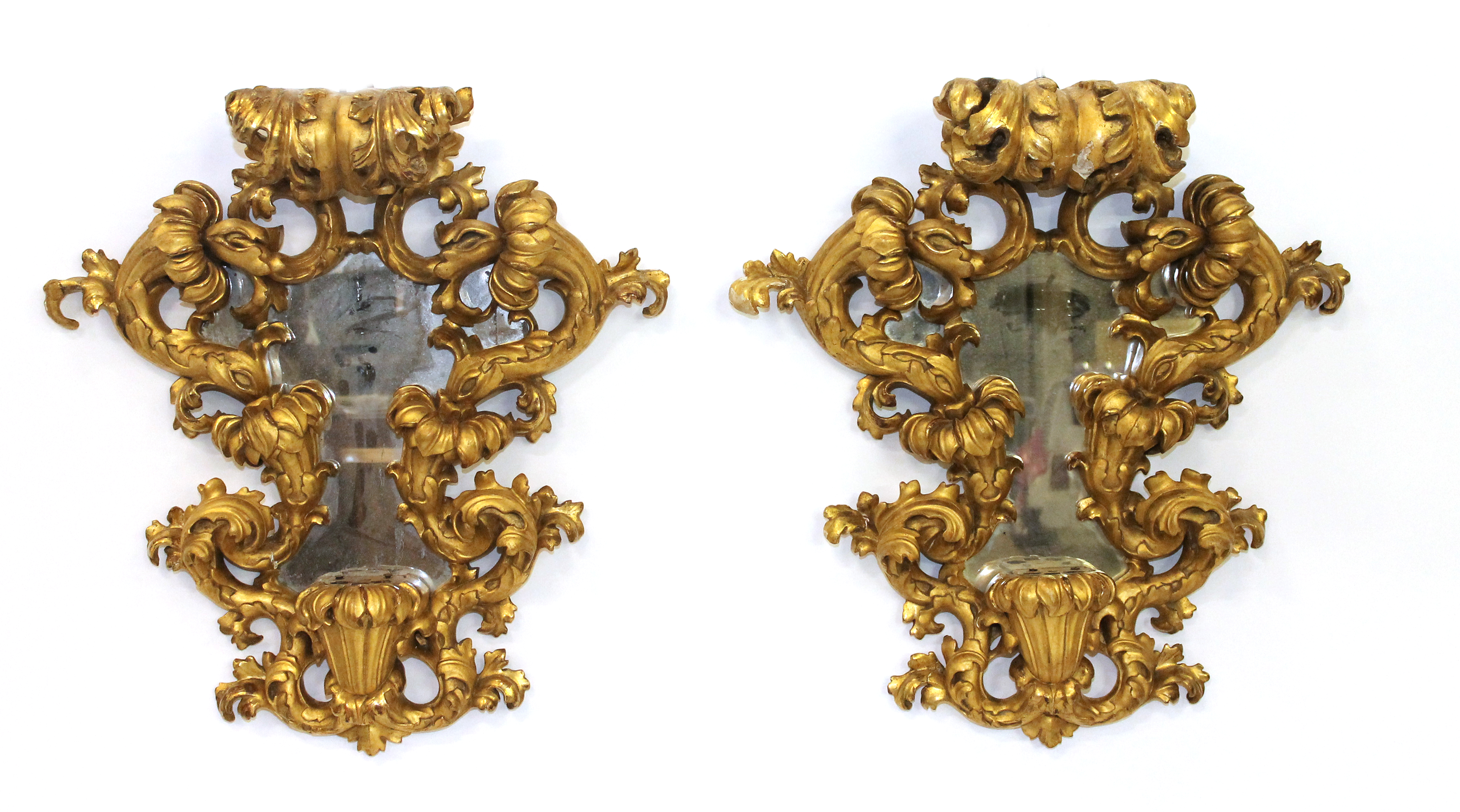 Appraisal: A pair of Italian late th century gilt framed wall