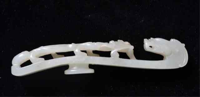 Appraisal: A Fine Chinese Qing Carved Jade BuckleFinely carved in white