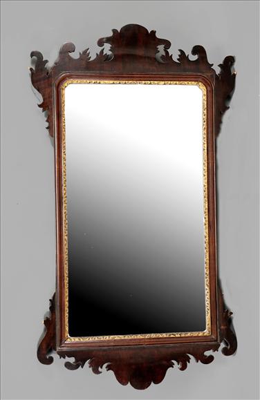 Appraisal: A George III mahogany and parcel gilt fretwork wall mirror