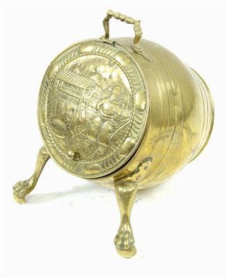 Appraisal: A Dutch brass coal scuttle the hinged lid embossed a