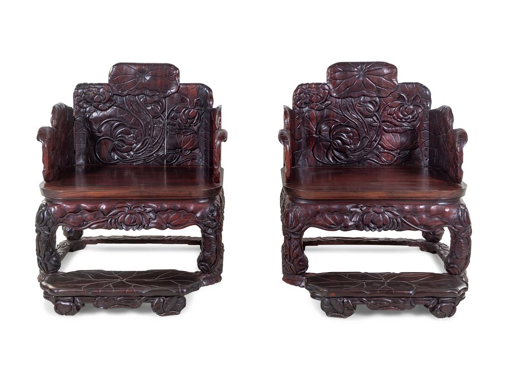 Appraisal: A Pair of Chinese Export Carved Hardwood Armchairs and Footrests