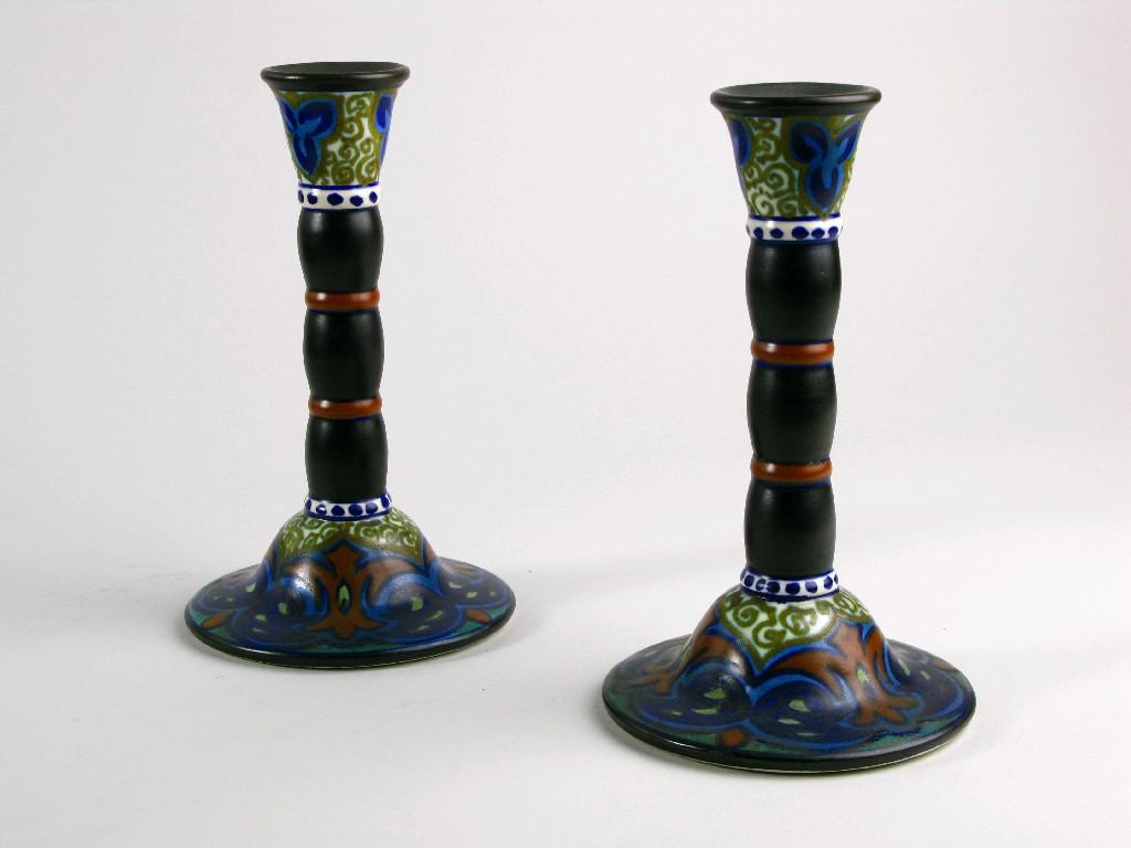 Appraisal: Pair of Dutch pottery Candlesticks with stylised leafage design in