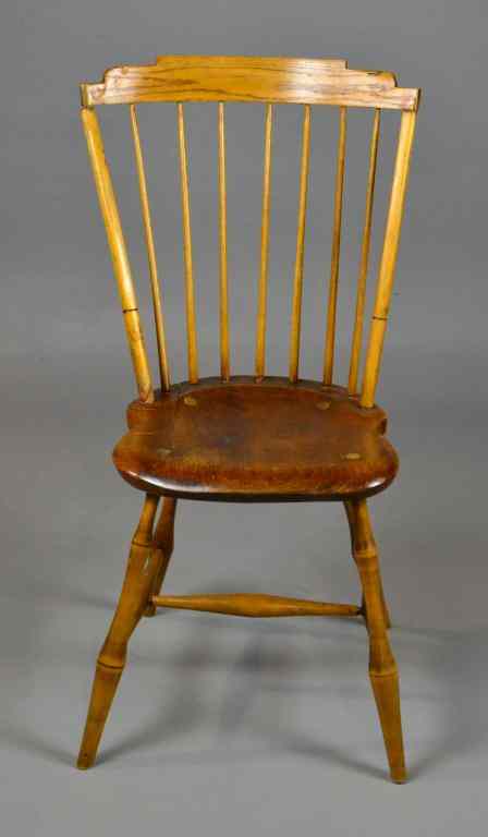 Appraisal: An American Bird Cage Windsor ChairWith planked seat shaped rail