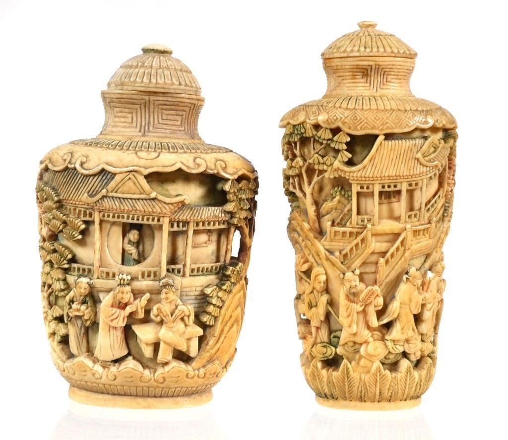 Appraisal: Two antique relief carved Chinese snuff bottles Nicely detailed scenes