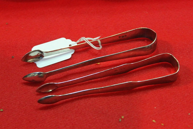 Appraisal: TWO PAIRS OF GEORGIAN SILVER SUGAR TONGS grams