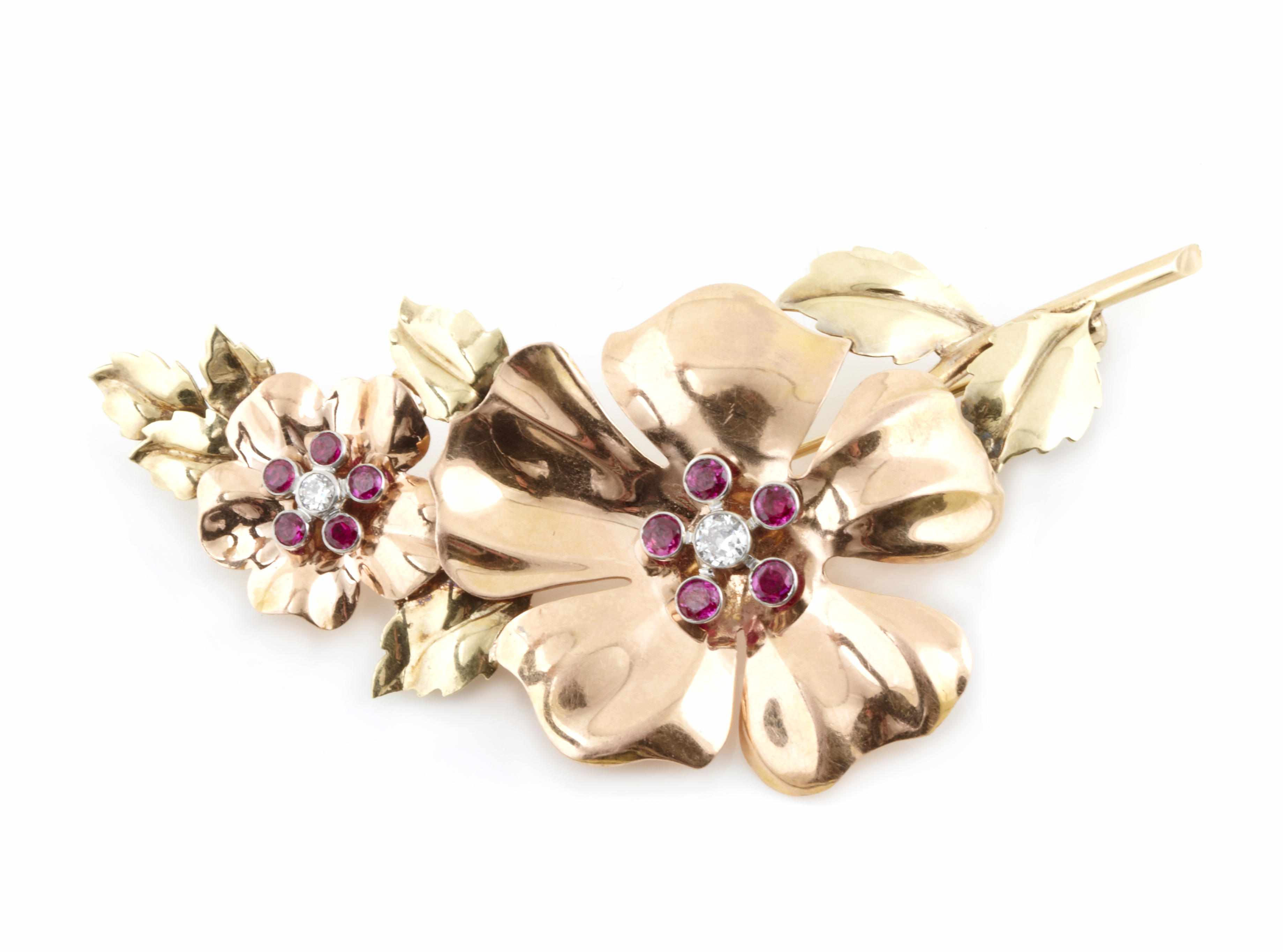 Appraisal: A ruby diamond and bicolor gold flower brooch g