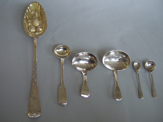 Appraisal: A silver table spoon later decorated as a fruit serving