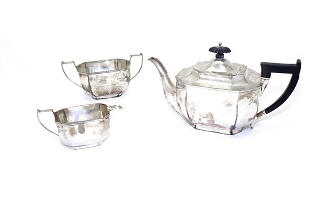 Appraisal: A silver three piece tea set comprising a teapot with