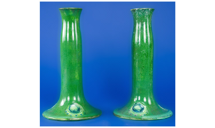 Appraisal: William Moorcroft Pair of Green Flamminian Candlesticks Signed to base