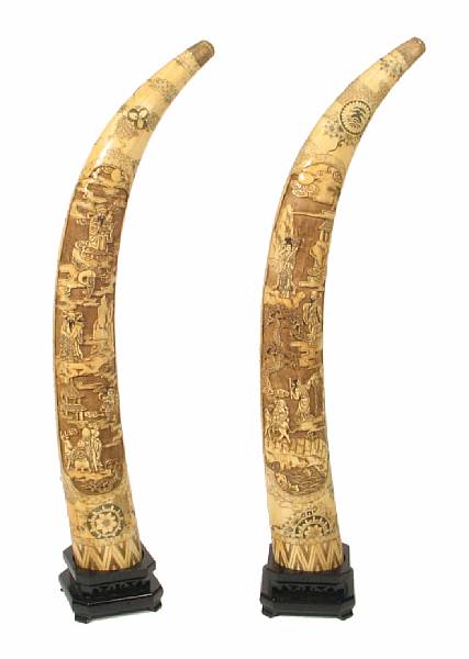 Appraisal: A pair of Chinese carved bone veneer tusks on stand