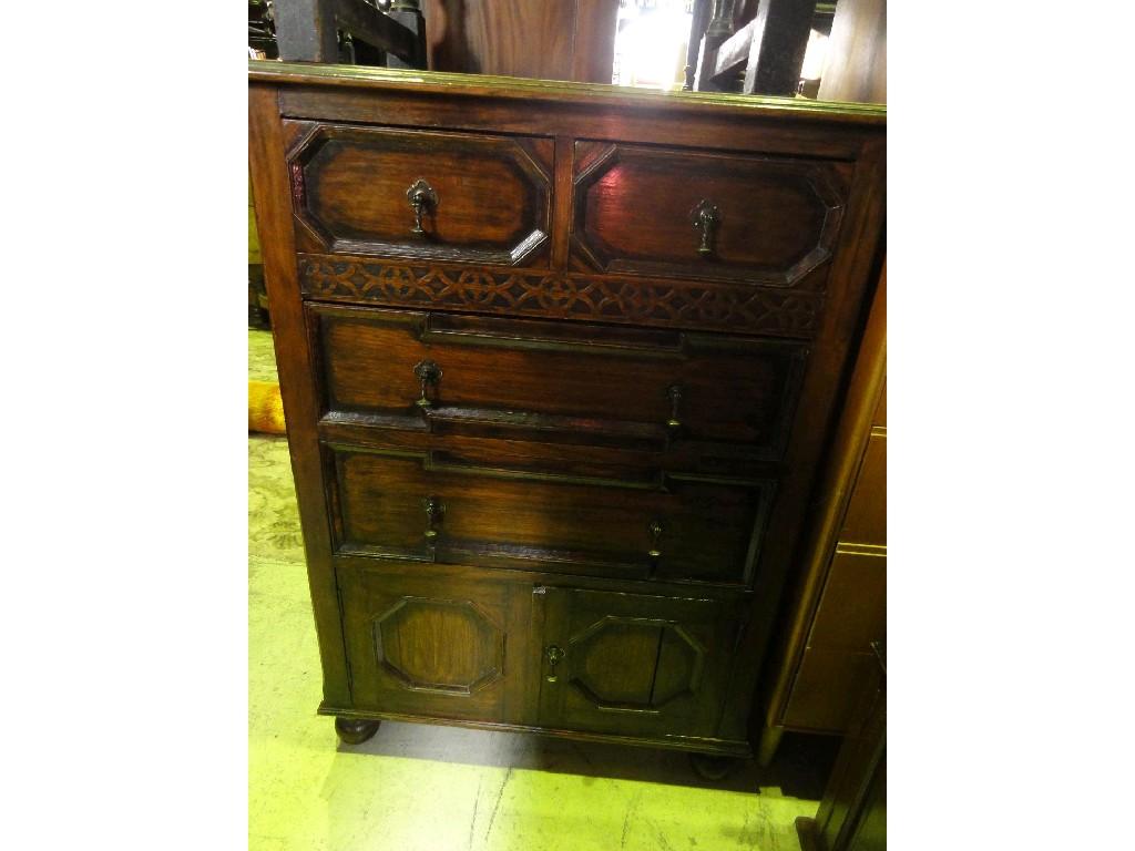 Appraisal: A 's Jacobean revival oak chest fitted with an arrangement