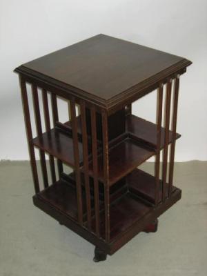 Appraisal: AN EDWARDIAN MAHOGANY REVOLVING BOOKCASE of square form crossbanded with