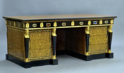 Appraisal: EMPIRE-STYLE KNEEHOLE WRITING DESK Gilt-tooled brown leather writing surface ebonized