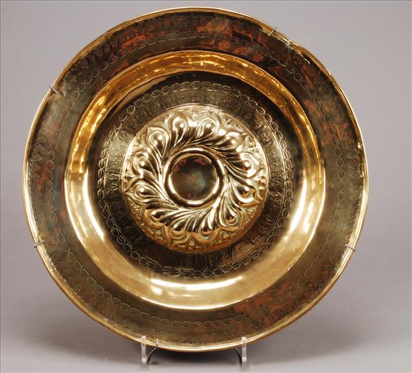 Appraisal: A Nuremberg brass alms dish late th century the raised