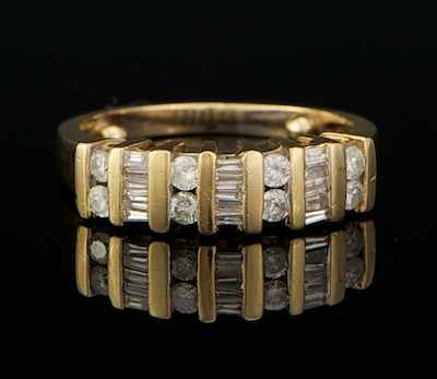 Appraisal: A Ladies' Round and Baguette Cut Diamond Band k yellow