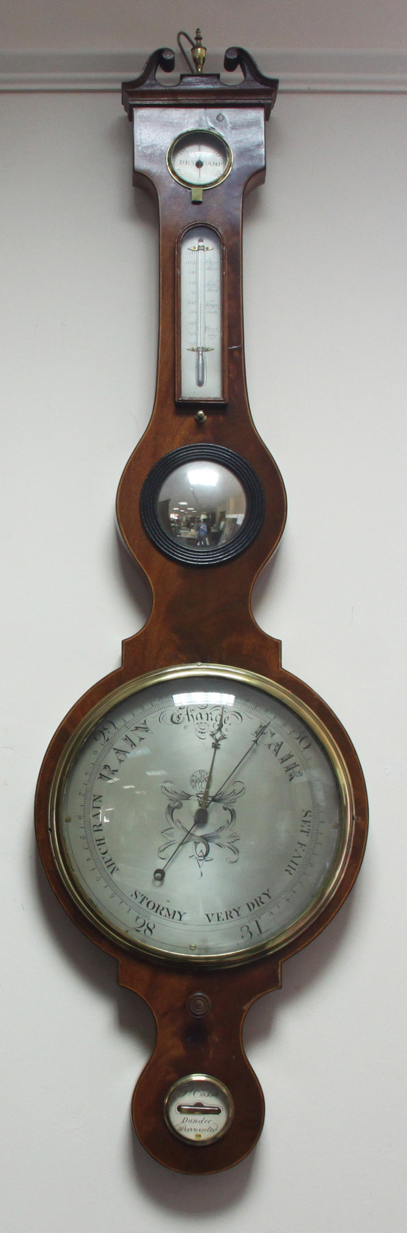 Appraisal: An early th Century mahogany banjo shaped barometer and thermometer