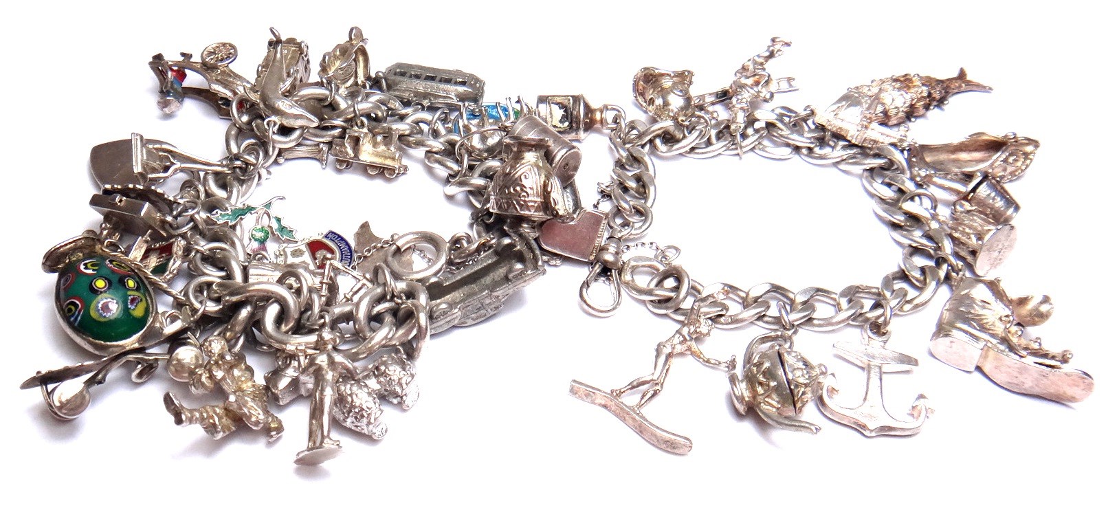 Appraisal: A silver curb link charm bracelet with a boltring clasp