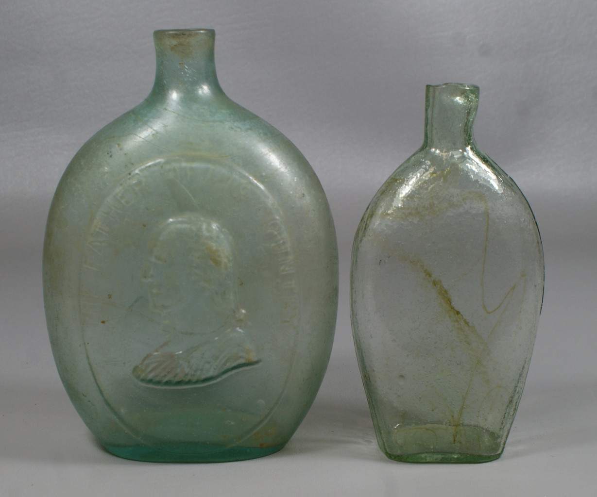 Appraisal: Light aqua pint flask with embossed THE FATHER OF HIS