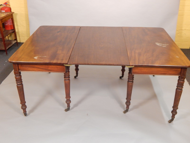 Appraisal: A George III mahogany D end extending dining table in