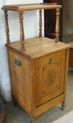 Appraisal: VICTORIAN OAK FIRESIDE STAND English c The small cabinet has