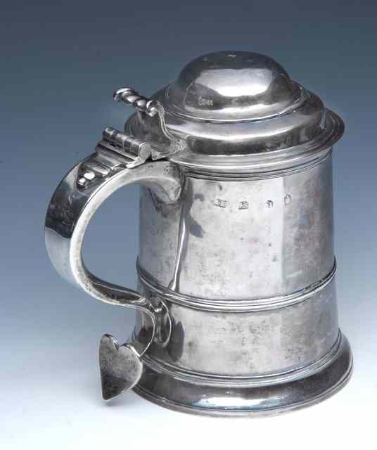 Appraisal: A GEORGE II SILVER TANKARD with tapering body and reeded