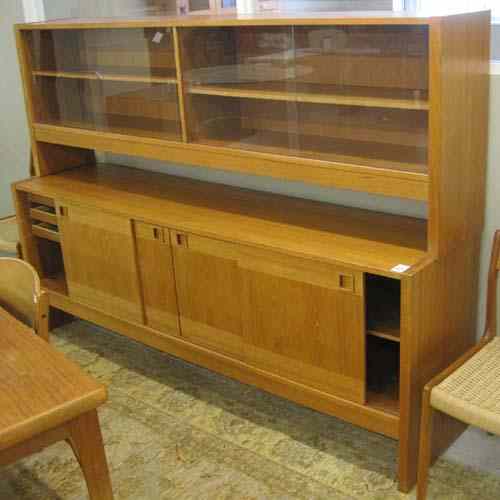 Appraisal: DANISH MODERN TEAK SIDEBOARD in two sections china display cabinet