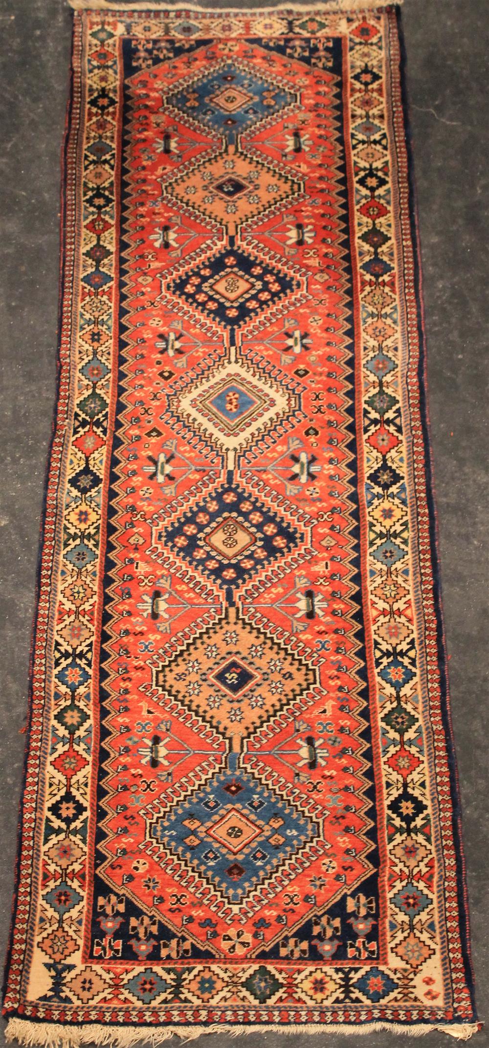 Appraisal: PERSIAN SHIRAZ RUNNER seven hexagonal pole medallions filled with various