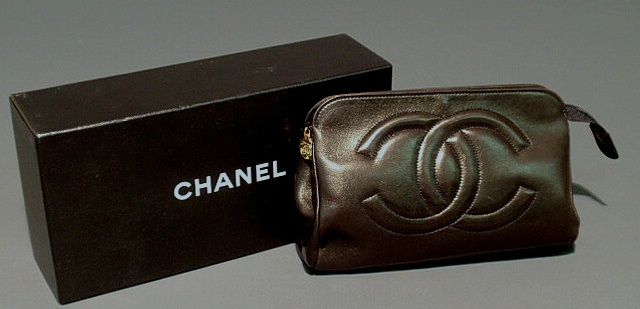 Appraisal: Chanel black leather cosmetic bag with quilted logo with box