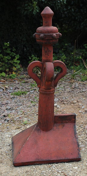 Appraisal: A VICTORIAN TERRACOTTA ROOF RIDGE FINIAL with stylised floral stem