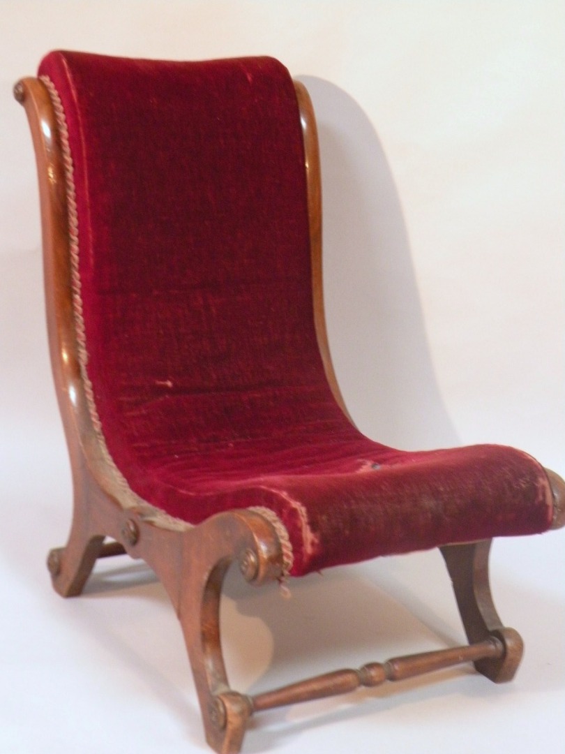 Appraisal: A late Victorian mahogany open nursing chair the sleigh shaped