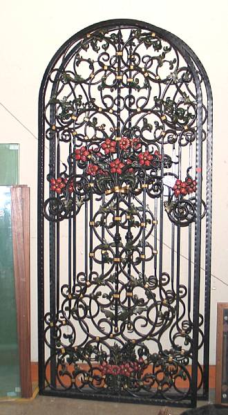 Appraisal: A pair of Rococo style tole and wrought iron gates