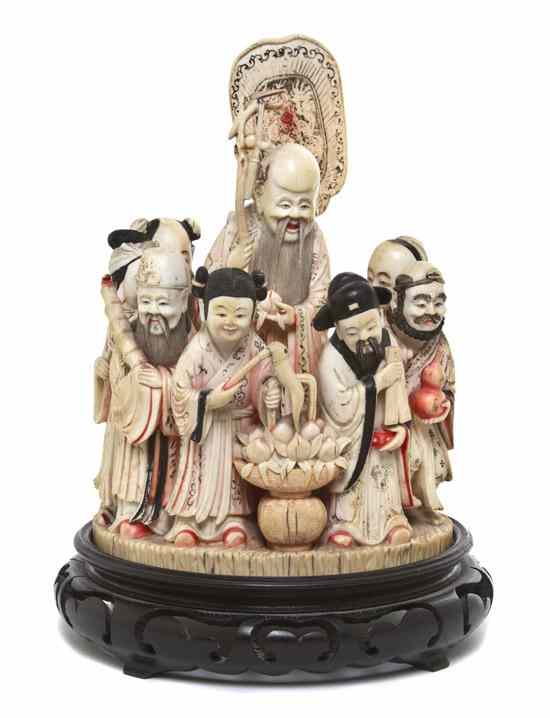 Appraisal: A Chinese Ivory Circular Carving of Ten Immortals the polychrome