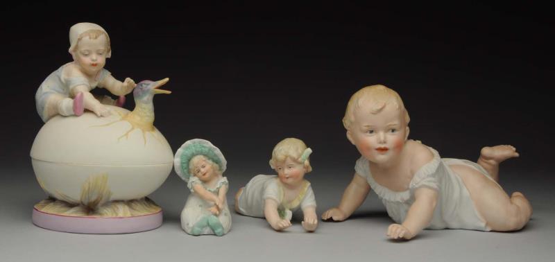 Appraisal: Lot Of Figurines Gebruder Heubach crawling baby with sunburst mark