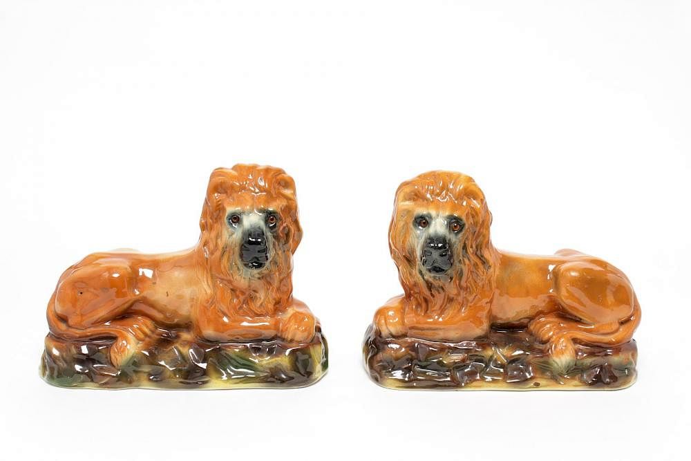 Appraisal: Staffordshire Porcelain Lions Pair Staffordshire porcelain lion figures with brown