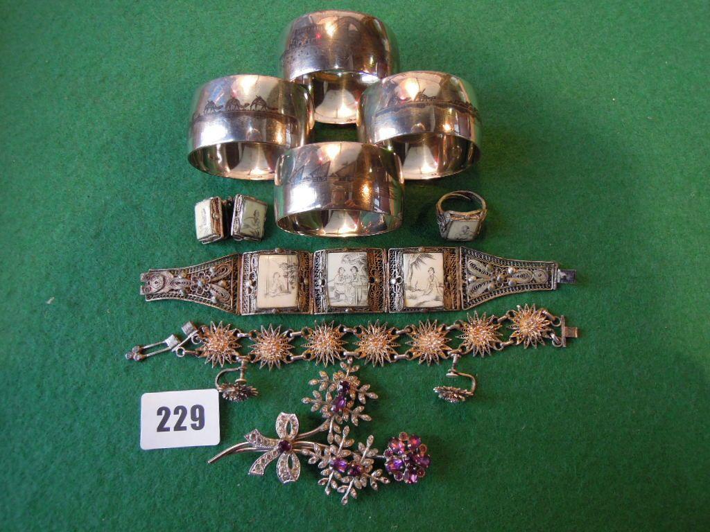 Appraisal: A collection of silver filigree jewellery Egyptian Niello work napkin