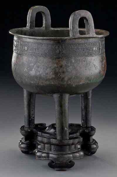 Appraisal: Chinese Yuan-Ming bronze tripod censer raised on original rosewood stand