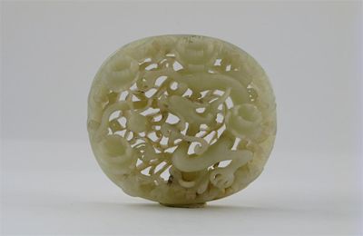 Appraisal: A Chinese jade oval plaque from a sceptre head reticulated