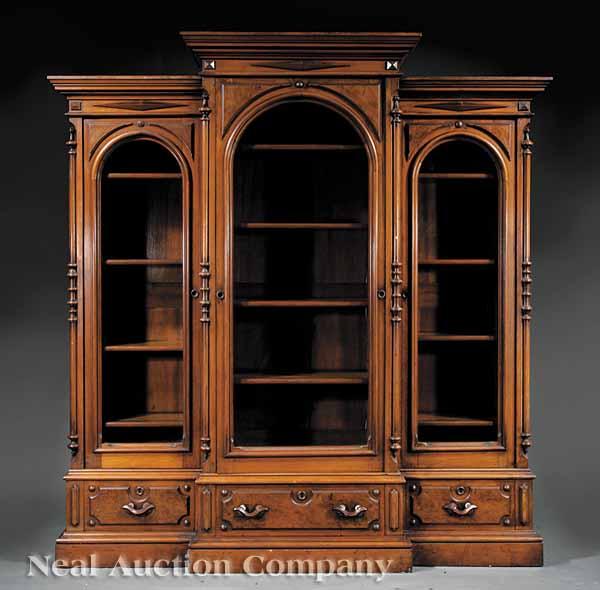 Appraisal: An American Renaissance Carved and Burl Walnut Breakfront Bookcase late