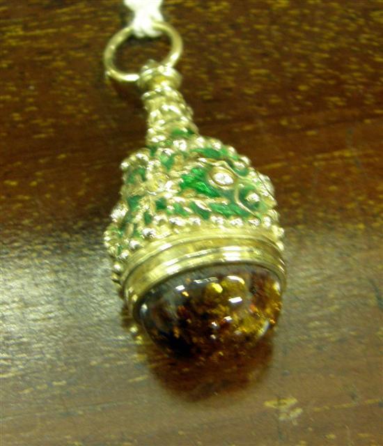 Appraisal: A RUSSIAN DIAMOND AND AMBER SET GREEN ENAMELLED GOLD EGG