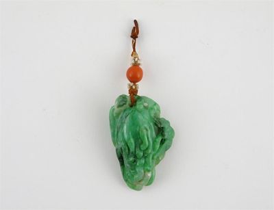 Appraisal: A Chinese jadeite carving of a finger citron upon which