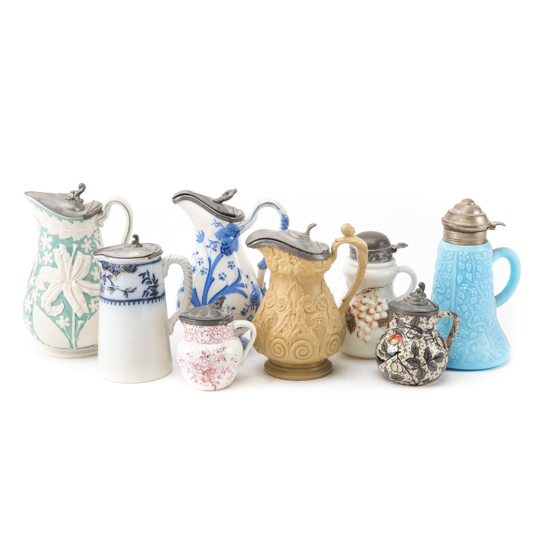 Appraisal: pewter-mounted syrup jugs th century includes porcelain and glass in