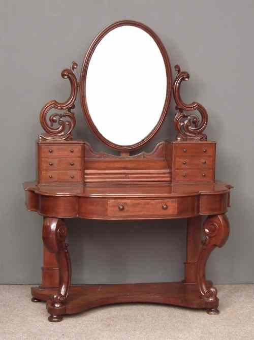 Appraisal: A Victorian figured mahogany bow-front ''Duchess'' pattern dressing table the