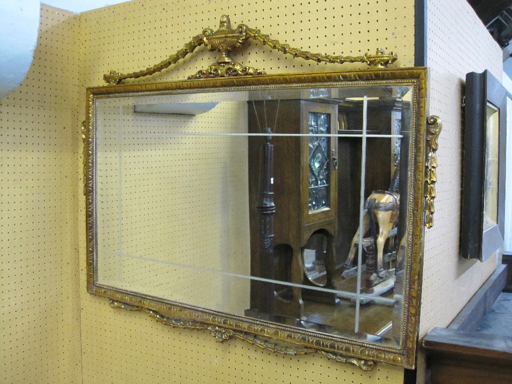 Appraisal: Gilt gesso framed mirror with urn and swag detail to