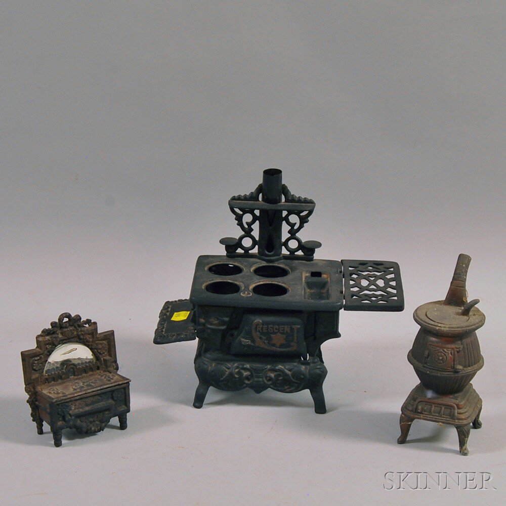 Appraisal: Two Miniature Stoves and a Cast Iron Matchsafe ht to