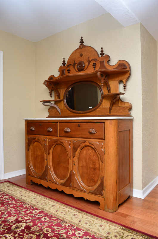 Appraisal: VICTORIAN MARBLE TOP SIDEBOARD Shaped crest with applied decoration open