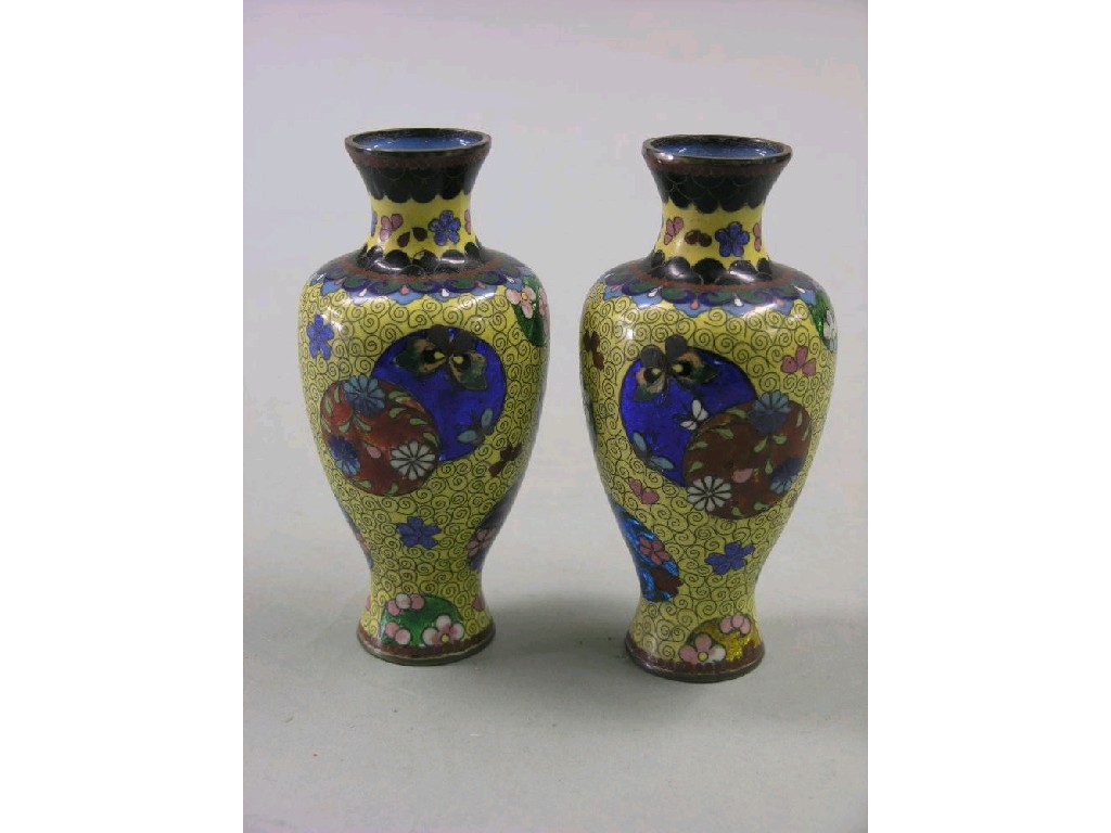 Appraisal: A pair of cloisonne vases baluster-shape decorated with flowerheads and