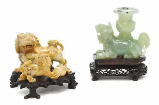 Appraisal: Two Chinese Hardstone Fu Dogs the first depicted in a