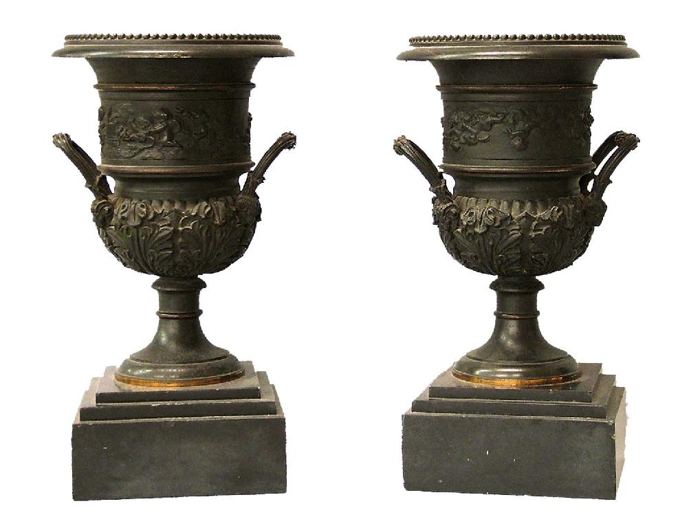 Appraisal: Pair of bronze twin handled campagna urns modelled with bands