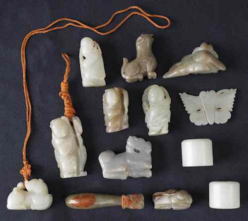 Appraisal: Thirteen Chinese carved jade accessories