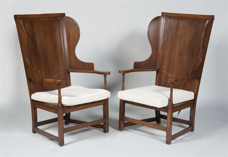 Appraisal: PAIR OF ENGLISH WALNUT WING CHAIRS With rope seats and